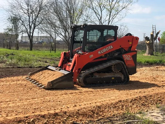 Kubota tracked skid steer performing dirt work